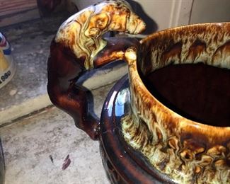 Close Up View Of A Full Body Sculptured Dog Handle Used For A Pottery Pitcher