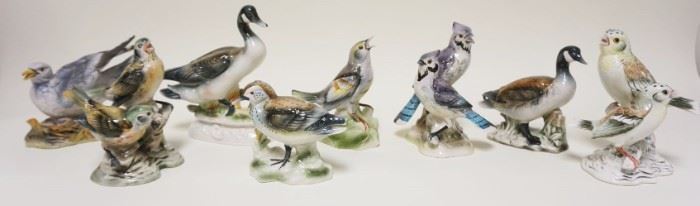 1011	LOT OF 8 PORCELAIN BIRD STATUES INCLUDING JSC, LARGEST APPROXIMATELY 8 IN HIGH
