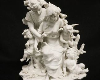 1017	BISQUE STATUE OF MAN & WOMAN W/CHERUBS, APPROXIMATELY 8 1/2 IN HIGH
