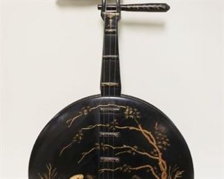 1023	BLACK LACQUERED ASIAN WALL HANGING IN THE FORM OF A BANJO, APPROXIMATELY 12 IN X 24 IN
