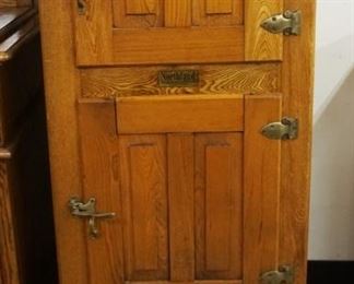 1179	ANTIQUE NARROW OAK *NORTH LAND* 2 DOOR ICE BOX WITH PANELED SIDE, APPROXIMATELY 17 IN X 21 IN X 51 IN H
