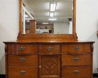 1180	LEXINGTON OAK 7 DRAWER CHEST WITH 1 DOOR AND BEVELED MIRROR TOP, APPROXIMATELY 64 IN X 21 IN X 81 IN H
