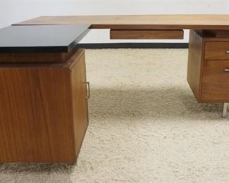 1206	MID CENTURY MODERN 3 DRAWER, 1 DOOR, L SHAPED DESK. SIDE L CAN BE REMOVED FOR STRAIGHT DESK, APPROXIMATELY 72 IN X 58 IN X 29 IN H OVERALL
