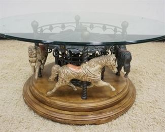 1221	EXCEPTIONAL REVOLVING GLASS TOP CAROUSEL HORSE COFFEE TABLE, APPROXIMATELY 74 IN X 21 IN H
