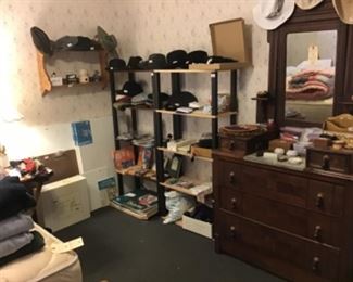 Marble top dresser, fedoras, berets, hats, art supplies