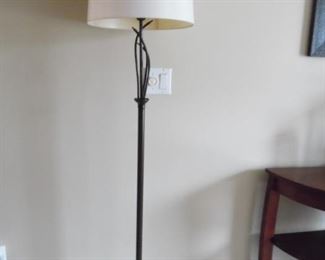 Tall metal floor lamp with foot control