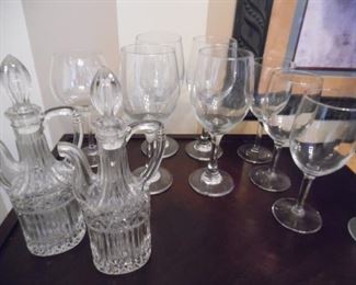 Oil and Vinegar cruets, along with mismatched bar glasses