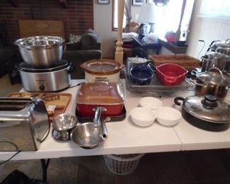 Crock pots bakeware, serving pieces, pots and pans.  Lots of high quality kitchen items