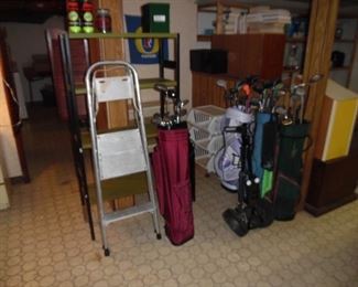 Golf clubs and bags, ladder and shelving