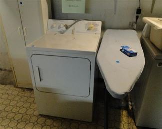 Dryer and ironing board, nice cabinet too
