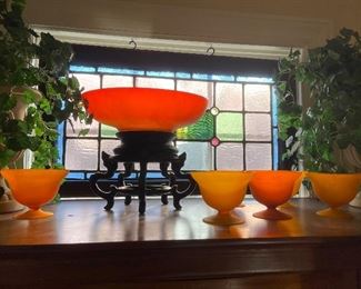 Beautiful art glass orange glow bowl on stand and desert cups.  Stain glass window is not for sale.  