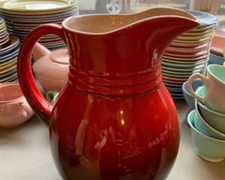 #144	Le Creuset Red Pottery Pitcher - 9.5" Tall	 $20.00 
