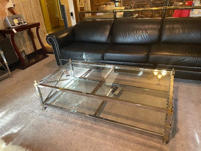 custom black leather w/ gold nail head trim- sectional w/ sleeper sofa=  chrome -brass -glass and lots of SASS IN THIS ONE !!