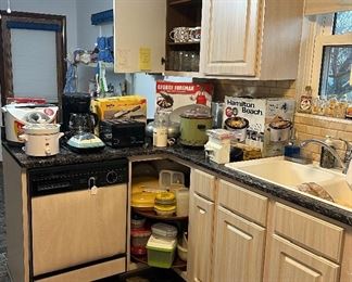 Small Appliances; Tupperware; Glassware; Stemware; Coffee Cups; Hamilton Beach Crock Pot 33156SZ; GE Electric Knife; Hamilton Beach Power Opener Under Cabinet; Vintage Rival Crock Pot; Hamilton Beach Micro Mini Food Processor Chip Chop; George Foreman Lean Mean Fat Reducing Grill; West Bend Coffee Pot; Sunbeam Fry Pan; Bella Kitchen Rotating Belgian Waffle Maker; Proctor Silex 4 Slice Toaster; B&D Coffee Pot; Sunbeam Rocket Grill; Vintage Presto Egg Cooker