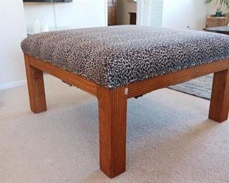 Solid Teak Ottoman. Imperted from Indonesia in ate 1970's. The upholstery screams of the 1970s however if leopard print is not your thing it will hold up very well to reupholstery because the craftsmanship is top notch.