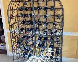 Custom made wrought iron wine cabinet (bottles for display only)
65”H. 41”W.  17” D