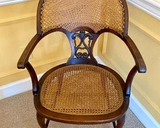 Antique caned fan back armchair
33” high. 21” wide. 