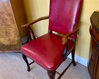 Pair of red armchairs with nailhead trim. 38” high
