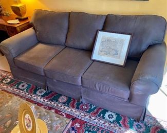 Brown upholstered sofa. 38” H. 86” W. 38” D

