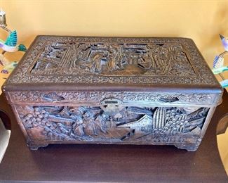 Carved oriental camphor chest. 10” H. 21”. W. 11.5” D 
