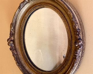 Oval gilt mirror 12x14”
