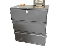 $300 USD     HON 3 Drawer Lateral Filing Cabinet Legal/Letter Dark Grey RC122-8      Description: HON four drawer 36"W lateral file is constructed of heavy gauge steel with a durable powder coat paint finish. Sleek outer case is fused to a nine-point steel grid frame that ensures proper drawer alignment.

Lateral file cabinet has an anti-tip mechanical interlock feature that keeps more than one drawer from opening at a time. Adjustable hang rails in each drawer accommodate letter or legal size file folders. Tamper resistant locks provide security. Cabinet meets ANSI/BIFMA safety standards. 

Dimensions: 36"W x 19.25"D x 42"H

Location: Local pick up SW Portland, Oregon.

Condition: In excellent condition with only very minor signs of wear commensurate of light use.      https://goodbyhello.com/products/copy-of-hon-4-drawer-lateral-filing-cabinet-legal-letter-in-dark-grey-rc121-6?_pos=29&_sid=d7a4d8c81&_ss=r