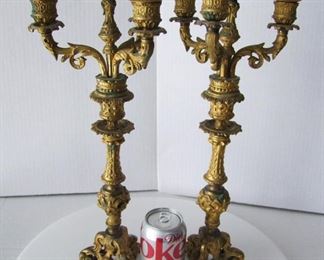 Lot 4   Pair of C/1860's French Gilt Bronze Candelabra, 4 socket each, Gothic style decoration on tri-feet.  17 1/4" h. x 8" dia.  Condition:  A few dark spots on the gilt, minor candle wax remnants on the arms, all candle cups are present.    