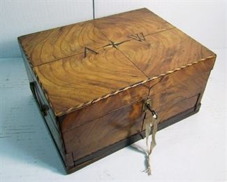 Lot 10   C/1840 Handmade Chestnut Sewing Box with inlaid "A - W" on lid, fitted interior w/thread spools and pin cushion, 11 1/2" x 9" x 6" h.  Condition:  Small edge chips, small piece missing from front bottom corner, a few shrinkage fractures, original key, works.    