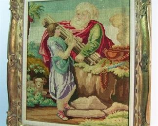 Lot 28   Mid 19th C. Wool Needlepoint of Old Testament Prophet preparing a sacrifice, 20" x 24" in a Mid 20th C. carved and gilt wood frame, 27" x 30 1/2" h.  Condition:  Slight toning overall w/slight staining on right side near edge, plus a few tiny moth bites.  