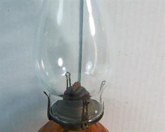 Lot 33   C/1890 Amber Glass Finger Oil Lamp, cross hatch in panel pattern, 11 1/2" h.  Condition:  Heavy wear underneath.