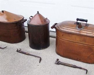 Lot 46   C/1920 3 Pc. Copper Still Set. Includes Cylindrical Cooker with Cone Top, 2 Covered Boilers with cone tops for Cooking Mash or Cooling Shine. Also includes 3 1920s Brass Torches for above. Various sizes, Condition: As Found, All with dents, scratches & dings. 