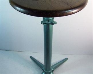 Lot 67   C/1950 Wood and Cast Iron Shop Stool, adjustable height, 25" h. x 19" sq. base.  Condition:  Repainted base and refinished seat. 