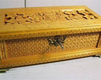 Lot 73   1999 Hand carved Sweetheart Jewelry box w/music box, made by Gary Waldon for Melody.  Includes original working key, interior mirror and brass feet, 13" x 7 1/4" x 4 1/2" .  Condition:  No damage to case, the music box chain is disconnected