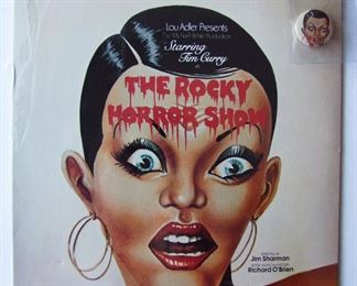 Lot 82   1975 "The Rocky Horror Show" Album for the Michael White Stage production with Lou Alder.  Recorded from the original Roxy Cast, 12 1/2" sq. Also includes a picture button given out at the theater on opening night.  Condition: Mint w/original sealed sleeve, un-played!