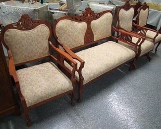 Lot 20A  C/1890 Victorian Cherry 5 Pc. Parlor Suite. Includes Settee, Platform Rocker, Arm Chair and 2 Side Chairs (1 has fully carved back). Condition: All refinished & newly upholstered.    Est.  $300 - 600