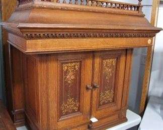 Lot 25A  C/1880 Victorian Oak Countertop Cabinet. Hand Painted doors, Spindle Galley Top & one drawer. 34"w. X 20"d. X 38" h.   Condition:  No damage, Orig. Finish.      Est. $250 - 450