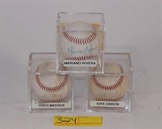 G. Maddux, M. Riveria, K. Gibson baseballs
