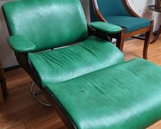 Classic mid-century  Eames style plywood and leather chair with original green upholstery with chrome legs. Such a great find.