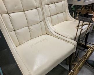 These are fun and practical. White leather mid-century awesome chairs. Why have one when you can have a pair.