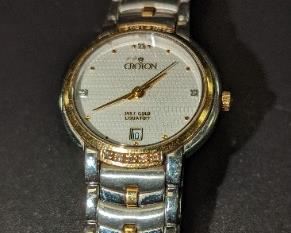 Croton ladies watch set in 18 karat gold and stainless