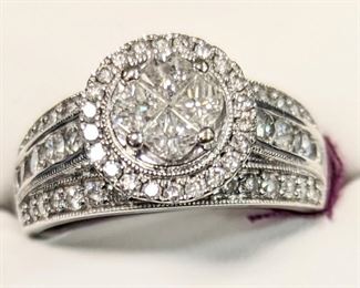 Diamond ladies wedding band surrounded by diamonds four individual stones in the center