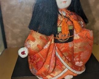 Japanese ceremonial doll in glass case