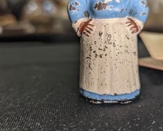 Cast iron, hard-working woman figurine