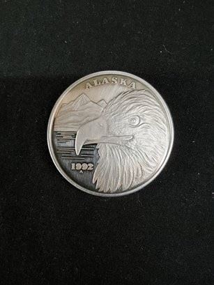 https://www.auctionninja.com/hewitt-estates-and-antiques/product/1992-alaska-state-silver-medallion-coin-eagle--1265.html
