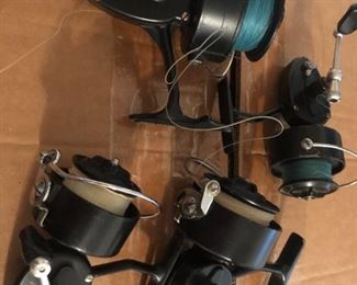 Fishing reels plus poles and other fishing items