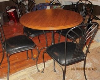 Oak and Wrought Iron table with 4 matching chairs