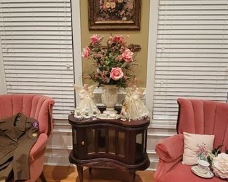 Kidney shaped table / framed floral art / pink chairs
