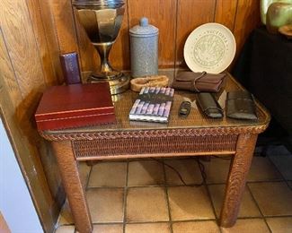 Wicker lamp table with glass top, City of Victoria Sesquecentennial plate, humidor, cigar holders