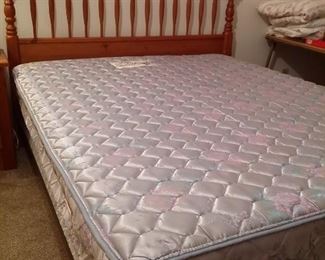 Queen bed with pine headboard