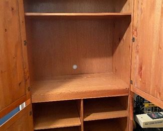 Cabinet could be used as an entertainment center or for  storage.